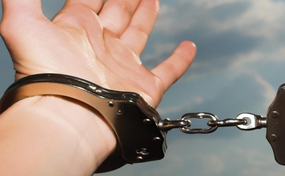 [Picture of Handcuffed Hand Reaching for the Sky]