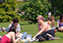 Photograph of students on the lawn outside the Fielding Johnson Building, with the Attenborough tower in the background